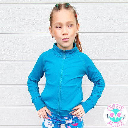 teal green gymnastics jacket from owlete active for young girls who love to be active during winter pockets thumb holes full zipper high neck