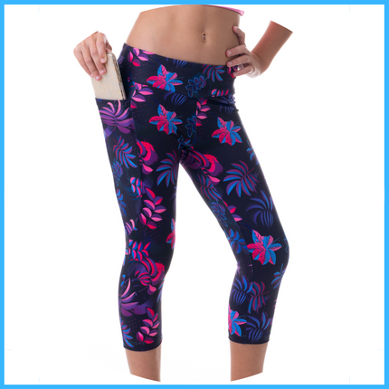 owlete active capri length tights in fluro colours with midnight blue background squat proof fabric and a pocket